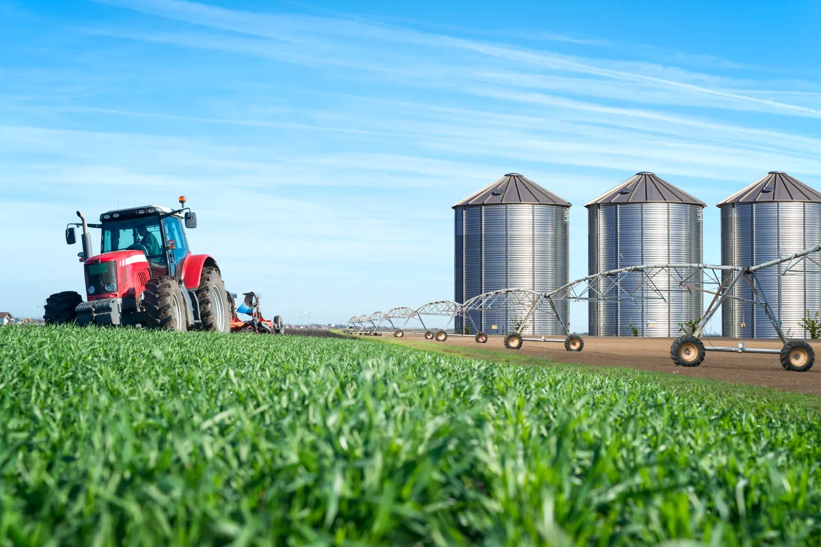 Farm irrigation infrastructure with tractor and silos for solar water-pumping design