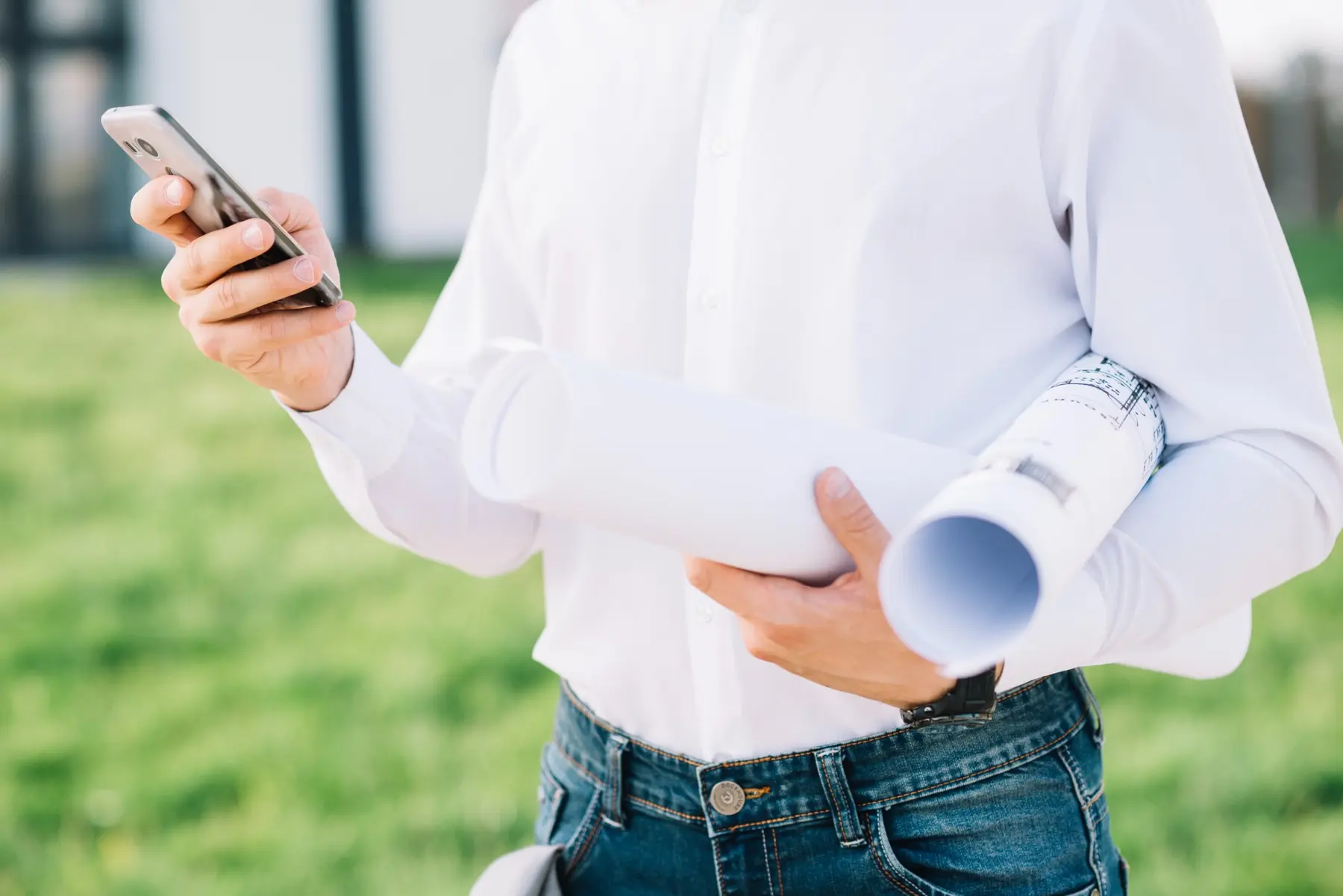 Solar project plans and smartphone ready for a detailed assessment
