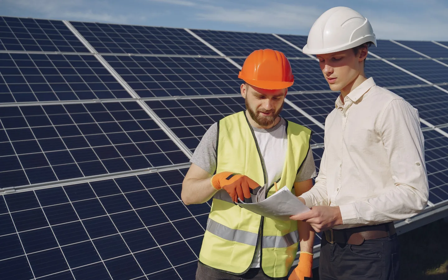 Solar engineer reviewing a photovoltaic installation for a commercial energy project