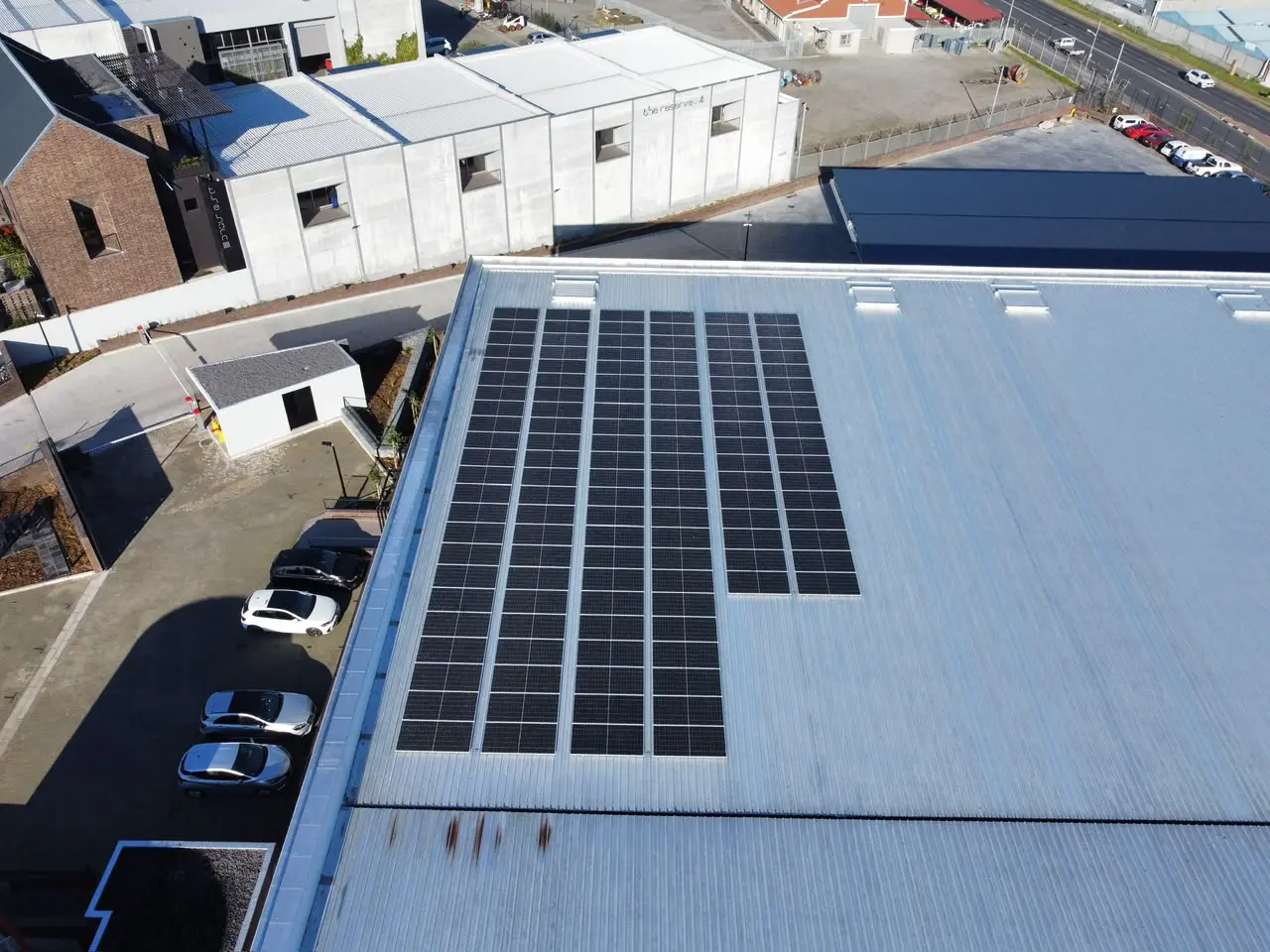 Commercial rooftop solar array photographed from above