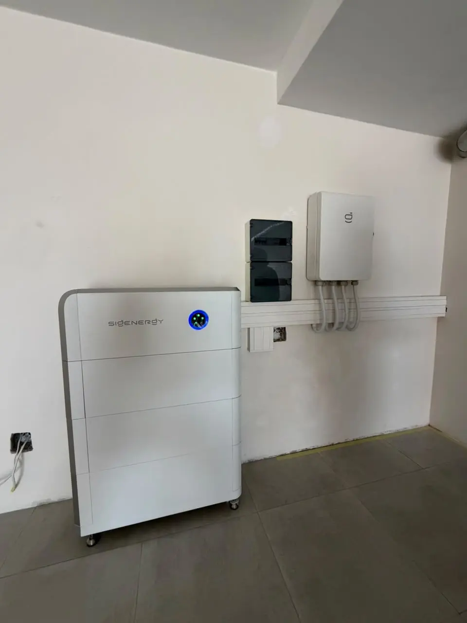 Residential Sigenergy SigenStor battery and inverter installation in a home utility area
