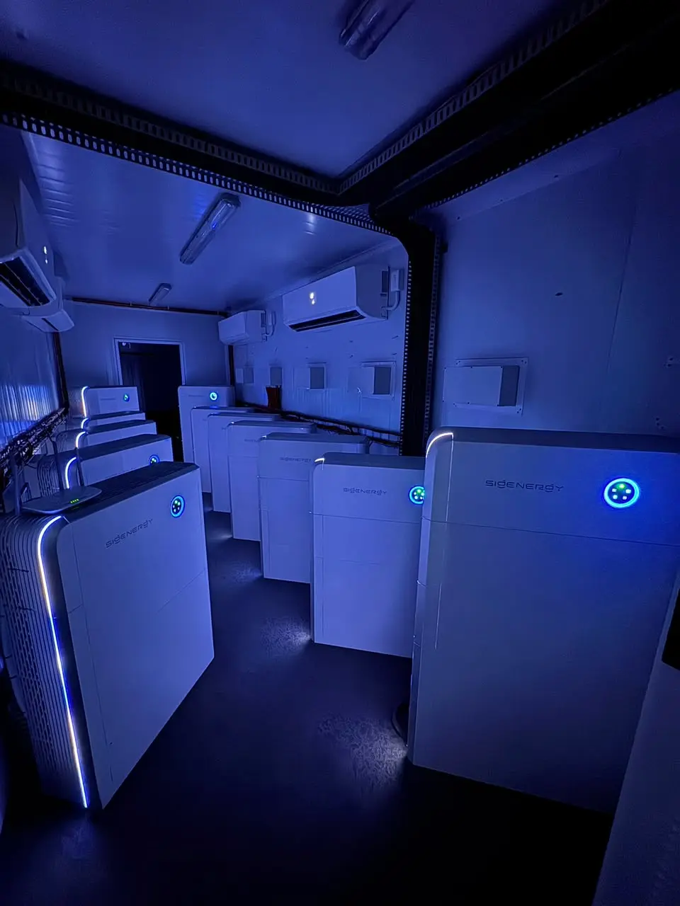 Sigenergy SigenStack style commercial battery storage room with multiple modular units